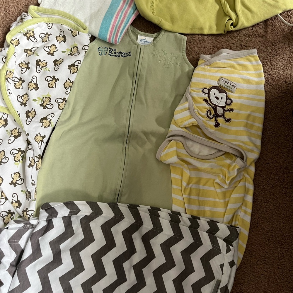 4 newborn sleep sacks, car seat cover and extra blanket